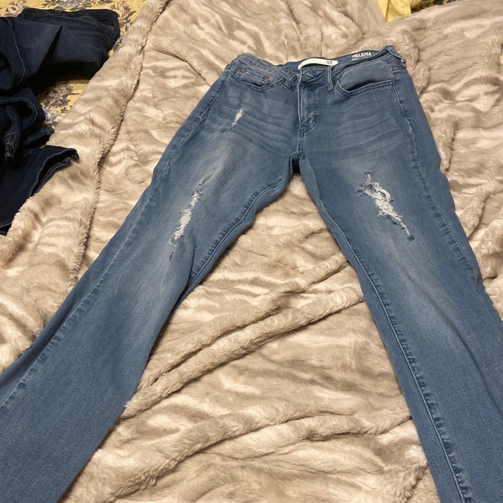 Distressed light denim high rise skinny ankle jeans